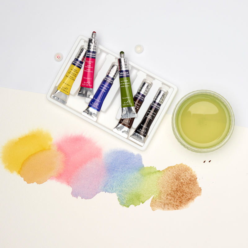 Image of a gradient of colours made from the colours within the Winsor and Newton watercolour introductory Tube Set.
